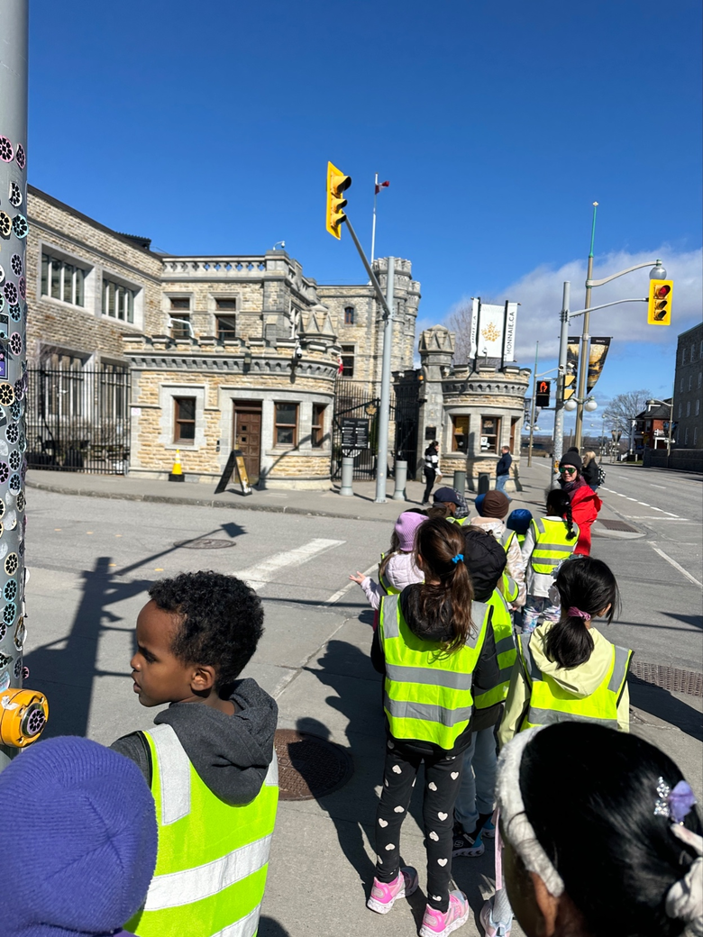 children walking in front of Royal Canadian Mint Building